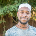 smiling black man looking at the camera